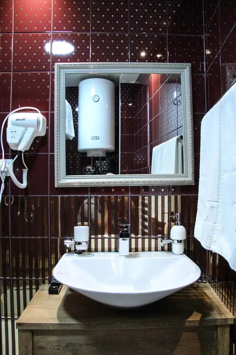 Private bathroom in the Deluxe Room at Villa Panuka
